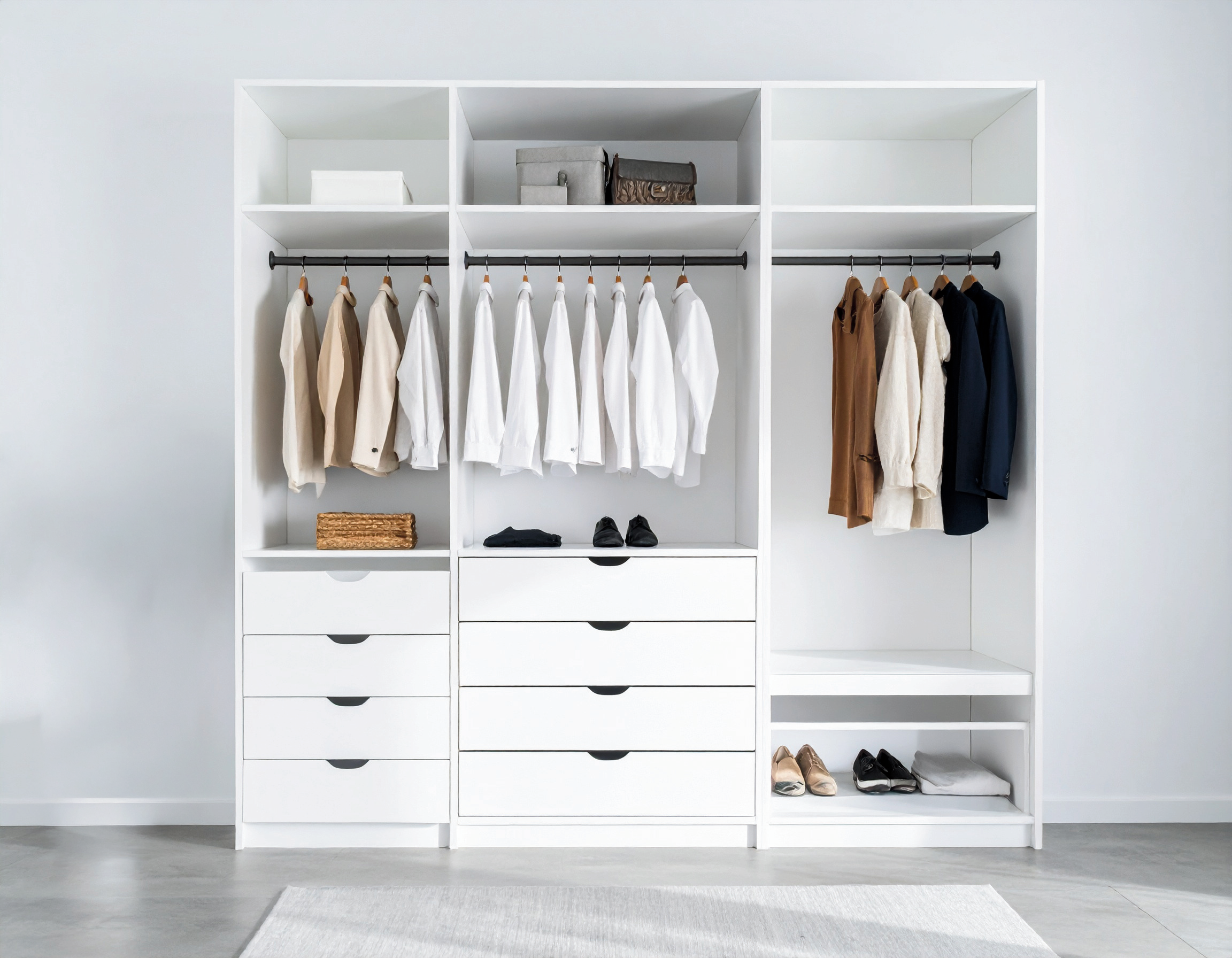 Clean elegant white closet system with spacious drawers, closet hanging rods, stackable closets and shelving
