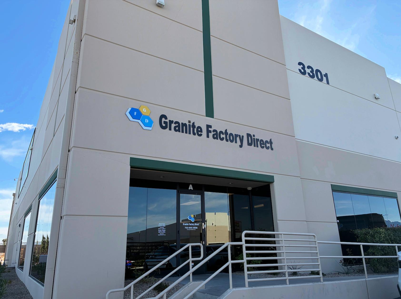Exterior of Granite Factory Direct showroom and warehouse building with modern commercial facade and entrance in Las Vegas.
